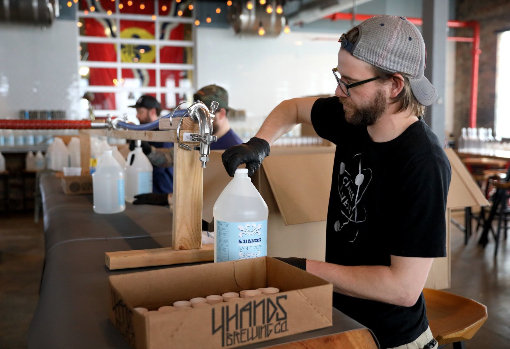 4 Hands Brewing packages hand sanitizer
